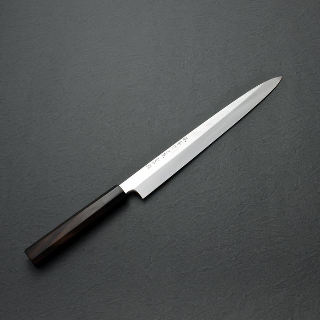 https://thechefdojo.com/wp-content/uploads/2018/09/sakai_takayuki_blue_steel_honyaki_yanagi_knife_ebony_handle.jpg