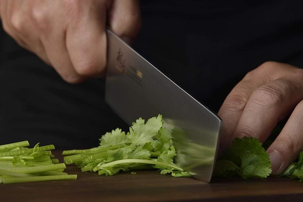 KYOCERA > The versatile nakiri gets the job done! The sharp wide blade  scoops up veggies fast!