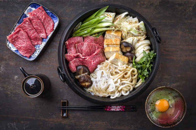 sukiyaki japanese hot pot dish with meat noodles and vegetables